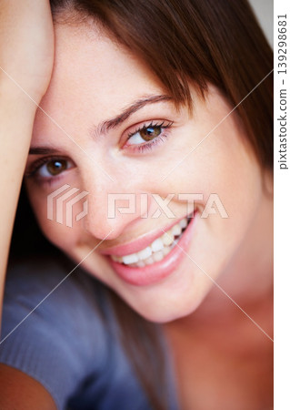 Happy, closeup and portrait of woman with beauty and positive attitude, confidence and smile in home. Attractive, relax and face of person with joy, cheerful and excited facial expression in house 139298681