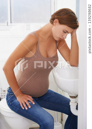 Vomiting, pregnant woman and morning sickness in bathroom, nausea and uncomfortable. Mirror reflection, moody and frustrated with illness, pregnancy and struggling with migraine pain on sink 139298682