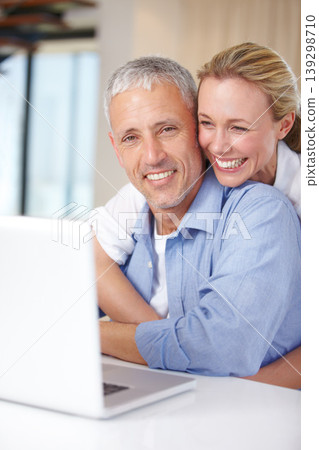 Married couple, laptop and remote work with smile, embrace and living room couch. Social media, technology and communication with love, man and woman with connection, streaming and conversation Married couple, laptop and remote work with smile, embrace and living room couch. Social media, technology and communication with love, man and woman with connection, streaming and conversation 139298710