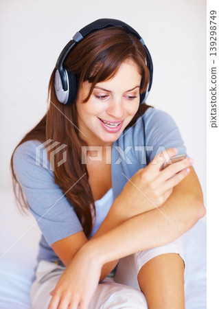 Headphone, music player or bedroom woman listen to playlist track, audio podcast or wellness sound. Relax morning, home bed or girl reading, search or streaming stress relief song, media or radio app Headphone, music player or bedroom woman listen to playlist track, audio podcast or wellness sound. Relax morning, home bed or girl reading, search or streaming stress relief song, media or radio app 139298749
