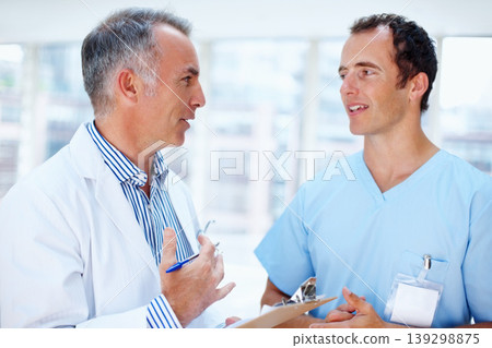 Healthcare, doctor and nurse with a clipboard, advice and communication with test results, career and wellness. Staff, medical and professional with documents, conversation or talking with physician Healthcare, doctor and nurse with a clipboard, advice and communication with test results, career and wellness. Staff, medical and professional with documents, conversation or talking with physician 139298875