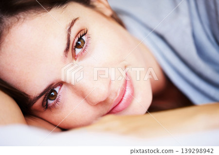 Rest, closeup and portrait of woman on bed for sleeping, dreaming and comfortable at home. Smile, morning and face of tired person in bedroom relaxing, nap and wake up for health, wellness and calm Rest, closeup and portrait of woman on bed for sleeping, dreaming and comfortable at home. Smile, morning and face of tired person in bedroom relaxing, nap and wake up for health, wellness and calm 139298942