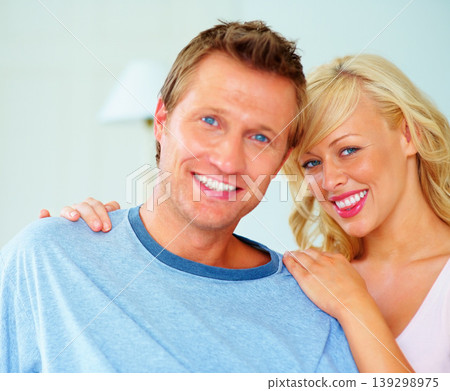 Love, portrait and couple hug in a house with bonding, care and security in their home together. Smile, face and woman embrace man in a living room with support, trust and romance in vacation freedom Love, portrait and couple hug in a house with bonding, care and security in their home together. Smile, face and woman embrace man in a living room with support, trust and romance in vacation freedom 139298975