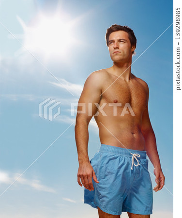 Man, thinking or fitness in health body for summer workout, muscle or confident on vacation. Model, pride and natural glow with fashion gym shorts, post cardio exercise and sunshine by sky background Man, thinking or fitness in health body for summer workout, muscle or confident on vacation. Model, pride and natural glow with fashion gym shorts, post cardio exercise and sunshine by sky background 139298985