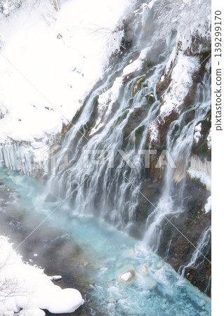 Biei in winter: Shirahige Falls, a snowy landscape and the clear blue Biei River. 139299170