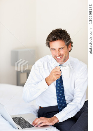 Business, man or coffee with laptop in bedroom for morning routine, email and networking with smile. Entrepreneur, person and thinking or happy with planning, communication or technology and internet Business, man or coffee with laptop in bedroom for morning routine, email and networking with smile. Entrepreneur, person and thinking or happy with planning, communication or technology and internet 139299188