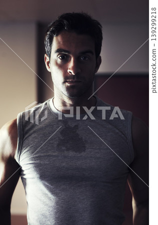 Portrait, sweat and serious man in the gym after a workout while feeling tired. Sportswear, athlete and exercise with a young male person in health centre for training for wellness and strength 139299218