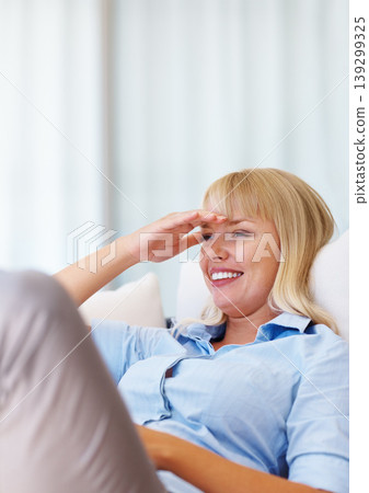 Smile, relax and young woman on a sofa with positive, good and confident attitude for peace. Happy, rest and female person from Australia laying on couch in the living room at modern apartment. Smile, relax and young woman on a sofa with positive, good and confident attitude for peace. Happy, rest and female person from Australia laying on couch in the living room at modern apartment. 139299325