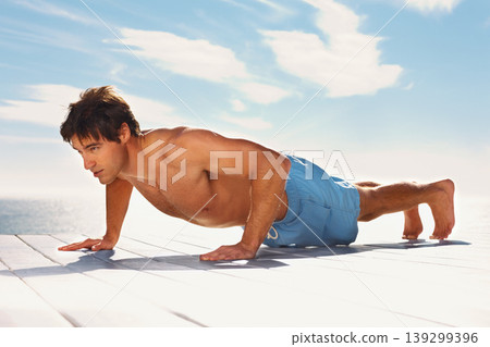 Man, push up and strong with training for health body, fitness and exercise by sky background. Young model, confident and natural glow with wellness and muscle workout outdoor on summer vacation Man, push up and strong with training for health body, fitness and exercise by sky background. Young model, confident and natural glow with wellness and muscle workout outdoor on summer vacation 139299396