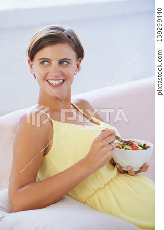 Pregnant woman, salad and happy on sofa for health, nutrition and wellness in living room of apartment. Person, vegetables or smile on couch of lounge for relax, pregnancy and healthy diet with fiber Pregnant woman, salad and happy on sofa for health, nutrition and wellness in living room of apartment. Person, vegetables or smile on couch of lounge for relax, pregnancy and healthy diet with fiber 139299440