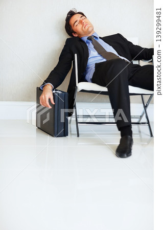 Business man, sleeping and case in lobby, chair and fatigue from travel, overworked or burnout in suit. Entrepreneur, briefcase and tired with rest, exhausted or luggage for corporate job with stress Business man, sleeping and case in lobby, chair and fatigue from travel, overworked or burnout in suit. Entrepreneur, briefcase and tired with rest, exhausted or luggage for corporate job with stress 139299481