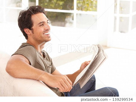 Man, reading and happy with newspaper on sofa for relax, morning break and information in living room. Person, face and smile for article, story and news on couch of apartment for headline or peace Man, reading and happy with newspaper on sofa for relax, morning break and information in living room. Person, face and smile for article, story and news on couch of apartment for headline or peace 139299534