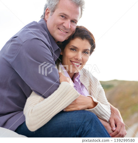 Couple, face and happy outdoor with hug for romance, love and relationship in nature with relaxing. Mature, man and woman or embrace with smile, comfort and trust for bonding, honeymoon and support 139299580