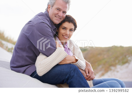 Couple, face and laughing in nature with hug for romance, love and relationship on beach with relax. Mature, man and woman or embrace with happy, peace and comfort for bonding, honeymoon and support Couple, face and laughing in nature with hug for romance, love and relationship on beach with relax. Mature, man and woman or embrace with happy, peace and comfort for bonding, honeymoon and support 139299582
