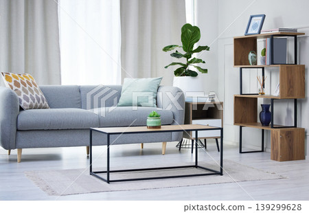 Modern house, living room interior and furniture with sofa, table and plants with carpet, curtain and style. Home decor, lounge and wood flooring with couch, space and apartment property with design Modern house, living room interior and furniture with sofa, table and plants with carpet, curtain and style. Home decor, lounge and wood flooring with couch, space and apartment property with design 139299628
