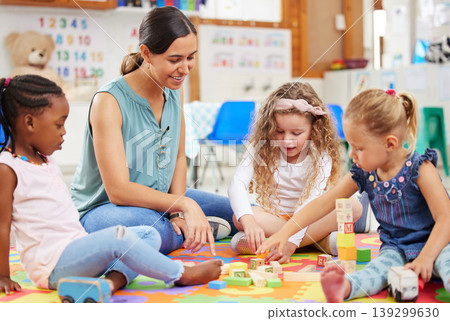 Toys, teacher and woman with education, students or ideas with conversation, lessons or teaching. Person, educator or children building, knowledge or kids in a classroom with kindergarten or learning Toys, teacher and woman with education, students or ideas with conversation, lessons or teaching. Person, educator or children building, knowledge or kids in a classroom with kindergarten or learning 139299630