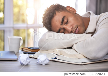 Man, student and sleeping at desk, burnout and mental health or overwhelmed, education and tired. Male person, nap and exhausted by university, learning and remote work or homework, rest and fatigue 139299641