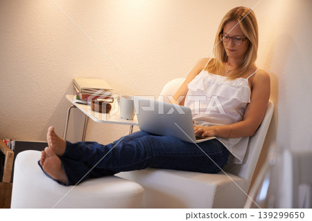 Woman, laptop and journalist typing in relax for online connection on chair in living room at home. Female person, freelancer or typist in remote work on lounge furniture for story writing at house Woman, laptop and journalist typing in relax for online connection on chair in living room at home. Female person, freelancer or typist in remote work on lounge furniture for story writing at house 139299650