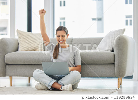 Winner woman, laptop and fist on floor for success, goal or bonus in trading, stock market or deal. Girl, computer and happy in home living room for cheers, invest or yes for profit, revenue or lotto Winner woman, laptop and fist on floor for success, goal or bonus in trading, stock market or deal. Girl, computer and happy in home living room for cheers, invest or yes for profit, revenue or lotto 139299654