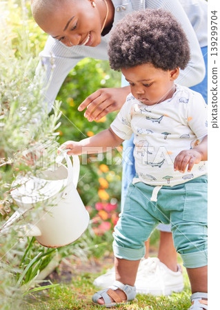 Mother, watering and child on plant with black family, love and support together with baby in garden. Lawn, green gardening and mom with happy kid, mama and backyard with youth and relax in nature Mother, watering and child on plant with black family, love and support together with baby in garden. Lawn, green gardening and mom with happy kid, mama and backyard with youth and relax in nature 139299704