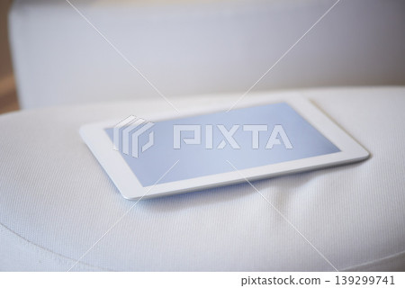 Tablet screen, internet and mockup on sofa in living room for online, communication or research. Technology, cellular and network for app, website or homepage for social media, post or meme in home Tablet screen, internet and mockup on sofa in living room for online, communication or research. Technology, cellular and network for app, website or homepage for social media, post or meme in home 139299741