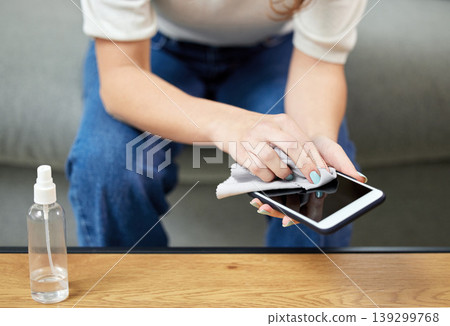 Woman, hand and clean phone screen or disinfection wipe for hygiene bacteria, dust wellness or safety. Female person, mobile device and cloth for germs or surface sanitizer, protection or dirt risk Woman, hand and clean phone screen or disinfection wipe for hygiene bacteria, dust wellness or safety. Female person, mobile device and cloth for germs or surface sanitizer, protection or dirt risk 139299768