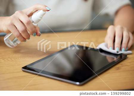 Hand, spray tablet and cloth for screen, dust or dirt with shine on glass, hygiene or disinfection in home. Woman, digital touchscreen and fabric, chemical or sanitation for bacteria, virus or health Hand, spray tablet and cloth for screen, dust or dirt with shine on glass, hygiene or disinfection in home. Woman, digital touchscreen and fabric, chemical or sanitation for bacteria, virus or health 139299802