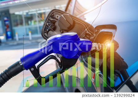 Petrol pump filling fuel nozzle in fuel tank of car at gas station. Petrol pump filling fuel nozzle in fuel tank of car at gas station. 139299824