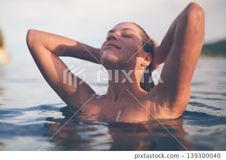 Ocean, swimming and woman with sea, happiness and relax with getaway trip, freedom and outdoor for fun. Person, traveller and girl with holiday, water and summer with weekend break, tourism or travel Ocean, swimming and woman with sea, happiness and relax with getaway trip, freedom and outdoor for fun. Person, traveller and girl with holiday, water and summer with weekend break, tourism or travel 139300040