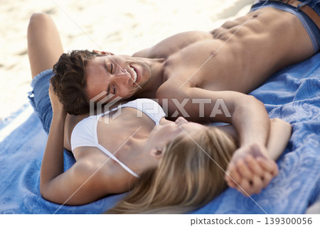 Laugh, holding hands and couple lying on beach for date, outdoor bonding or tropical holiday. Romance, man and woman at picnic, love and relax on vacation together with travel, care and adventure. Laugh, holding hands and couple lying on beach for date, outdoor bonding or tropical holiday. Romance, man and woman at picnic, love and relax on vacation together with travel, care and adventure. 139300056