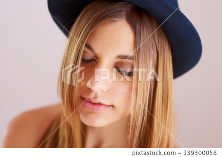 Woman, eyes closed and hat for fashion in studio with mock up for style on white background. Swedish model, hairstyle and confidence by satisfaction on face with vintage, clothes and fedora in space 139300058
