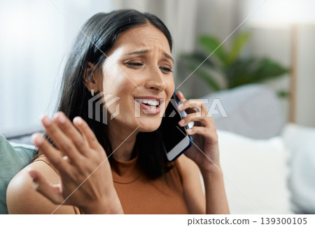 Stress, phone call and woman on sofa frustrated with network, fail or phishing scam at home. Anxiety, face and angry female person in a living room with smartphone, conversation and conflict disaster Stress, phone call and woman on sofa frustrated with network, fail or phishing scam at home. Anxiety, face and angry female person in a living room with smartphone, conversation and conflict disaster 139300105