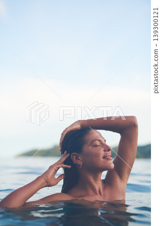 Ocean, swimming and woman with sea, outdoor and relax with getaway trip, freedom and vacation for fun. Person, traveller and girl with holiday, water and summer with weekend break, tourism or travel Ocean, swimming and woman with sea, outdoor and relax with getaway trip, freedom and vacation for fun. Person, traveller and girl with holiday, water and summer with weekend break, tourism or travel 139300121