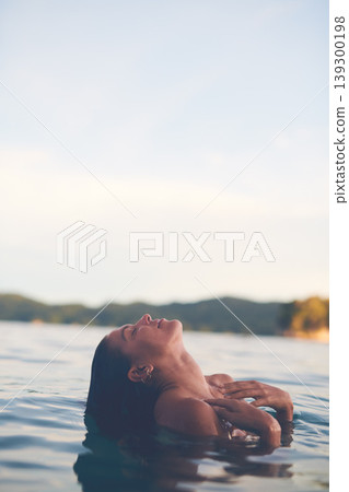 Ocean, swimming and woman with vacation, sea and relax with getaway trip, freedom and outdoor for fun. Person, traveller and girl with holiday, water and summer with weekend break, carefree or travel Ocean, swimming and woman with vacation, sea and relax with getaway trip, freedom and outdoor for fun. Person, traveller and girl with holiday, water and summer with weekend break, carefree or travel 139300198