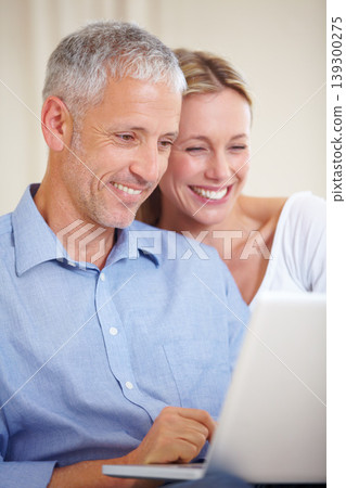 Mature couple, laptop and smiling with video call, conversation and living room couch. Social media, technology and communication with family, man and woman with connection, streaming and happy Mature couple, laptop and smiling with video call, conversation and living room couch. Social media, technology and communication with family, man and woman with connection, streaming and happy 139300275