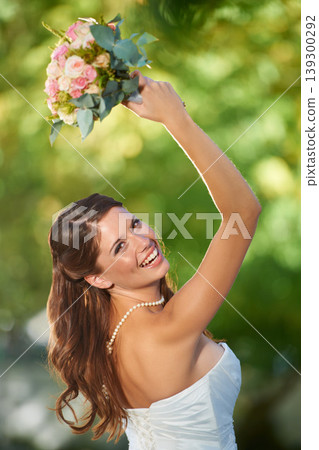 Woman, throwing and wedding rose bouquet with love, commitment and trust ceremony for marriage. Engagement, celebration and flowers for event in a park with a red floral plant and bride dress outdoor Woman, throwing and wedding rose bouquet with love, commitment and trust ceremony for marriage. Engagement, celebration and flowers for event in a park with a red floral plant and bride dress outdoor 139300292