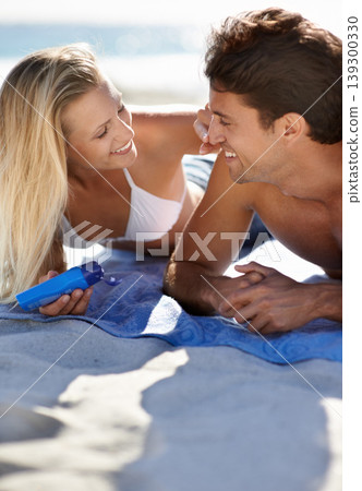 Beach, happy couple and apply sunscreen for face care hydration, wellness or wife helping with skincare UV protection. Sun cream application for husband skin safety, solar security or SPF sunblock 139300330