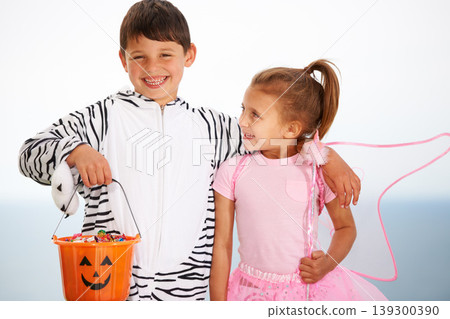 Family, children and siblings with halloween, costume or hug outdoor with love, care or fun together. Happy, smile and kids in character for festival, holiday or fantasy, playing or bond with freedom Family, children and siblings with halloween, costume or hug outdoor with love, care or fun together. Happy, smile and kids in character for festival, holiday or fantasy, playing or bond with freedom 139300390