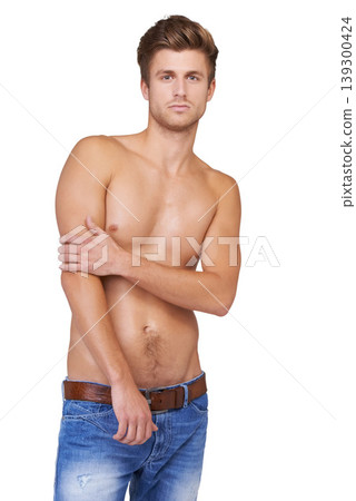 Portrait, shirtless and handsome man with pose in casual clothing on a white studio background. Backdrop, fashion and strong topless male person in denim jeans with bare chest for confidence Portrait, shirtless and handsome man with pose in casual clothing on a white studio background. Backdrop, fashion and strong topless male person in denim jeans with bare chest for confidence 139300424