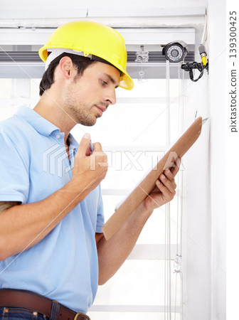 Technician, checklist and home security camera for CCTV installation, documents and reading safety insurance. Man thinking or engineering with clipboard for surveillance information and services Technician, checklist and home security camera for CCTV installation, documents and reading safety insurance. Man thinking or engineering with clipboard for surveillance information and services 139300425