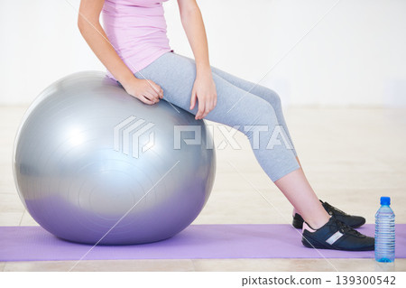 Woman, ball and balance or exercise on mat for .cardio or progress training, workout for fitness. Female person, sports for gym club or active healthy, strong wellbeing challenge for performance gear Woman, ball and balance or exercise on mat for .cardio or progress training, workout for fitness. Female person, sports for gym club or active healthy, strong wellbeing challenge for performance gear 139300542