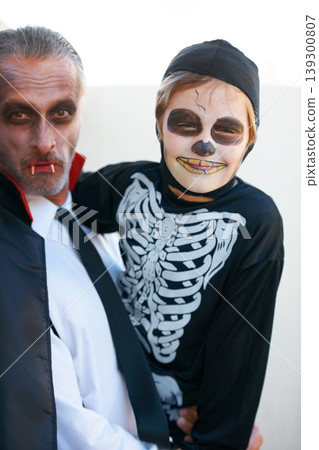 Portrait, halloween and costume with a father and his son outdoor for a trick or treat tradition together. Family, horror or spook with a parent and child in an outfit for celebration in the holidays 139300807