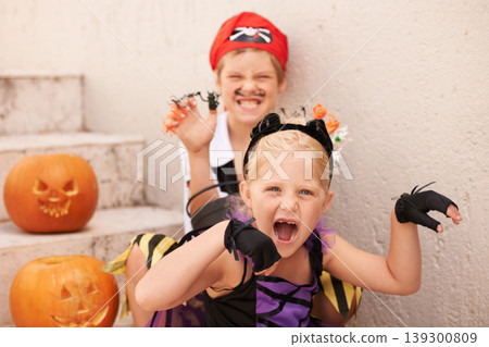 Siblings, portrait and halloween costume by outdoor, theme paint and happiness in childhood. Boy, girl or scary face for holiday party event with pumpkin, excited fairy or pirate by backyard stairs Siblings, portrait and halloween costume by outdoor, theme paint and happiness in childhood. Boy, girl or scary face for holiday party event with pumpkin, excited fairy or pirate by backyard stairs 139300809
