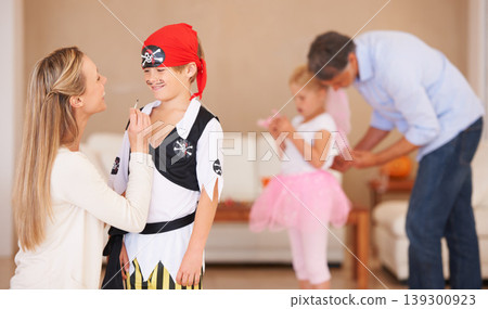 Boy, pirate costume and halloween with mother in home, face paint and happiness in childhood. Son, smile and house birthday with party clothes by woman, love family and celebration together with care 139300923