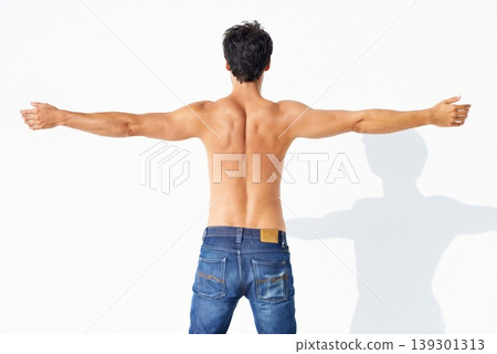 Back, muscle and shirtless with man, fitness and promotion isolated on a white studio background. Person, guy and model with exercise, jeans and strong with health, mockup space and body with care 139301313