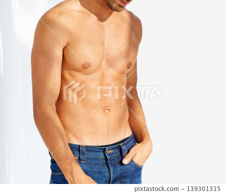 Fashion, tattoo and shirtless with a man outdoor on a white background for edgy or unique style. Health, fitness and denim jeans with the body of a model in the sunlight for masculine or macho style Fashion, tattoo and shirtless with a man outdoor on a white background for edgy or unique style. Health, fitness and denim jeans with the body of a model in the sunlight for masculine or macho style 139301315
