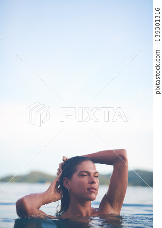 Ocean, swimming and woman with sea, travel and relax with getaway trip, freedom and outdoor for vacation. Person, tourism or girl with holiday, water and summer with weekend break, carefree or travel Ocean, swimming and woman with sea, travel and relax with getaway trip, freedom and outdoor for vacation. Person, tourism or girl with holiday, water and summer with weekend break, carefree or travel 139301316