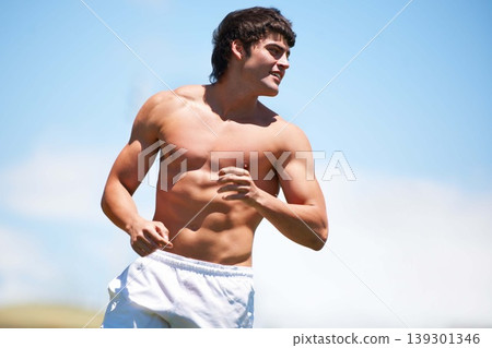 Fitness, sports and man outdoor for running, training and sports, wellness or morning cardio on blue sky background. Health, exercise or topless guy runner outside with summer, freedom or workout run Fitness, sports and man outdoor for running, training and sports, wellness or morning cardio on blue sky background. Health, exercise or topless guy runner outside with summer, freedom or workout run 139301346