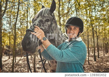 Portrait of woman with horse in forest, smile and pride for competition, race or dressage with trees. Equestrian sport, face of jockey or rider with animal in woods for adventure, training and care. Portrait of woman with horse in forest, smile and pride for competition, race or dressage with trees. Equestrian sport, face of jockey or rider with animal in woods for adventure, training and care. 139301432