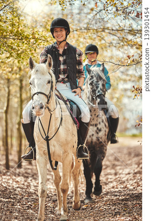 Portrait, women and horses in a forest, happiness and woods with animal care, stallion and countryside. Adventure, pets and girls with joy, activity and relax with hobby, bonding together and friends 139301454